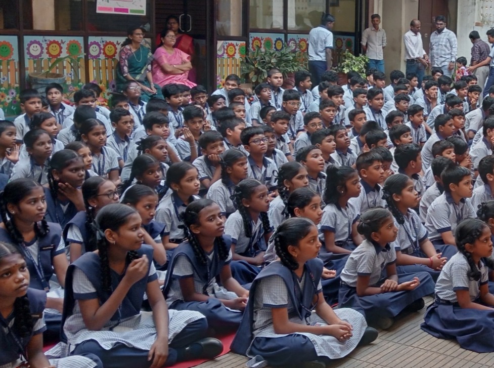 Large student gathering on campus showing the school community